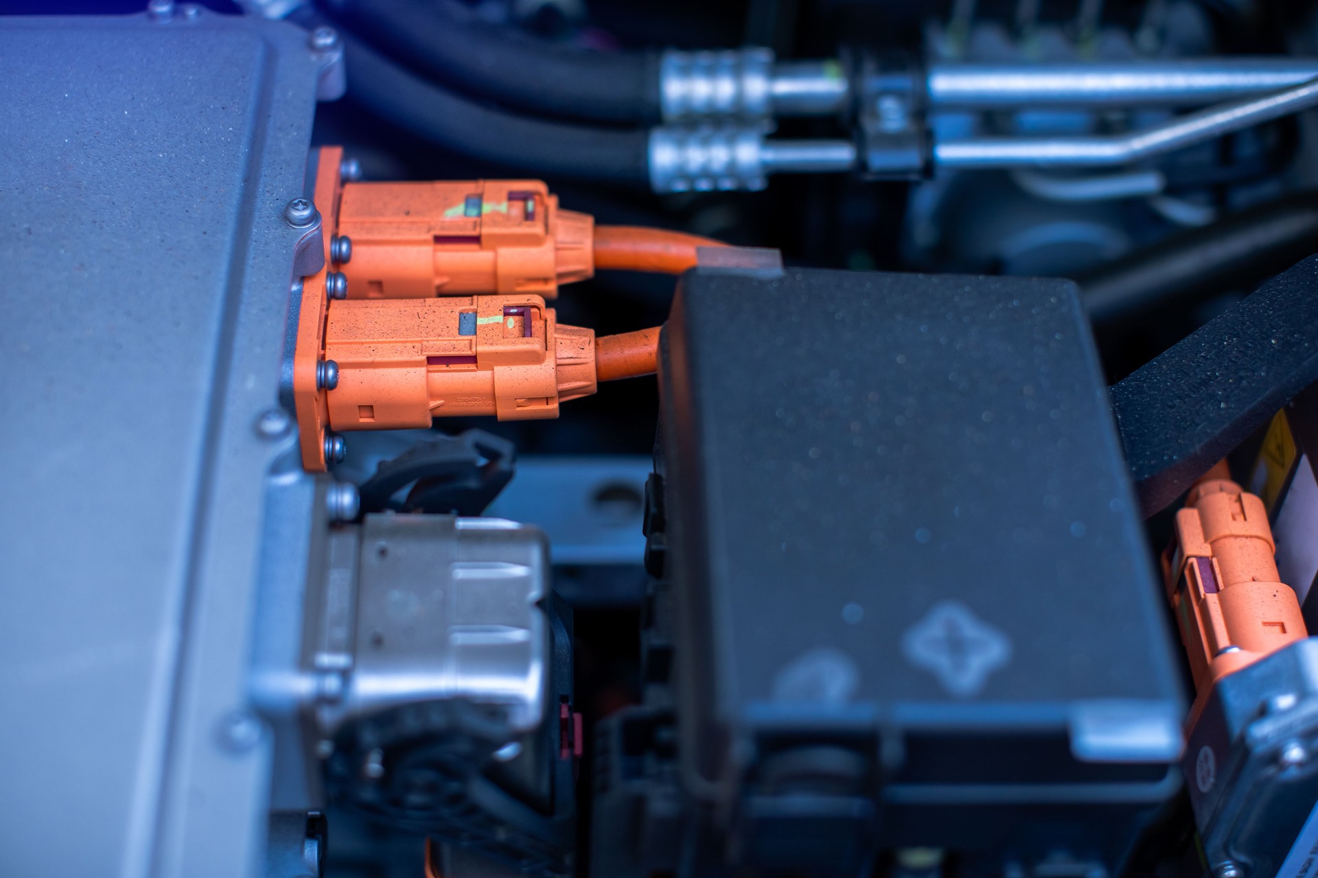 EV engine car engine block under hood electric vehicle high power and environmentally friendly zero emission. Chassis of the electric car with powertrain and power connection.